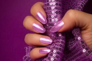 Stylish purple ombre nails with intricate purple nail art designs featuring light purple chrome accents and elegant purple French tips, perfect for both casual and formal looks.