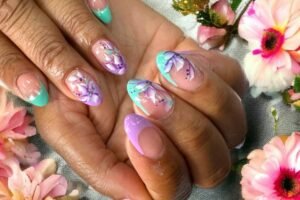 Assorted flower nails designs including pink flower nails, blue flower nails, and cute spring and summer nails with floral accents.