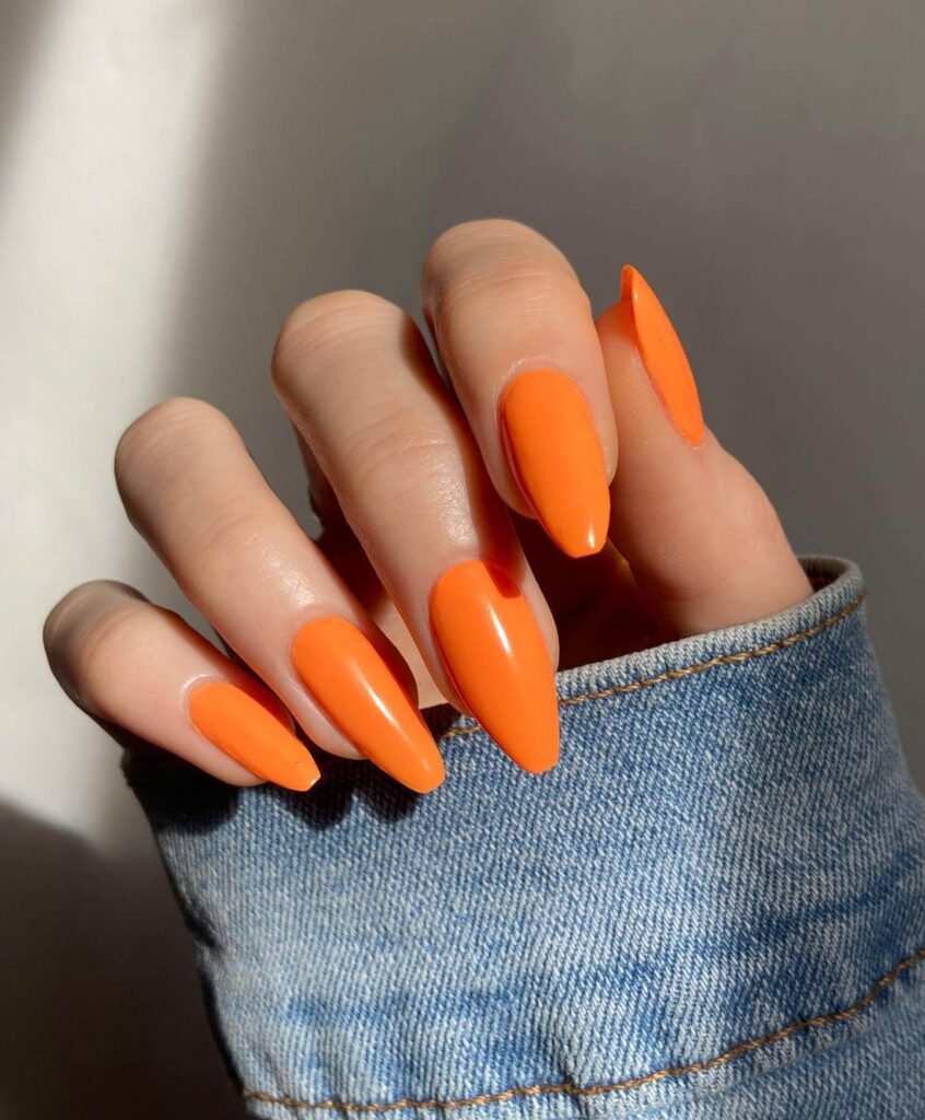 Vibrant orange nail art featuring ombre orange nails, neon orange, and orange french tip nails designs for a chic look.