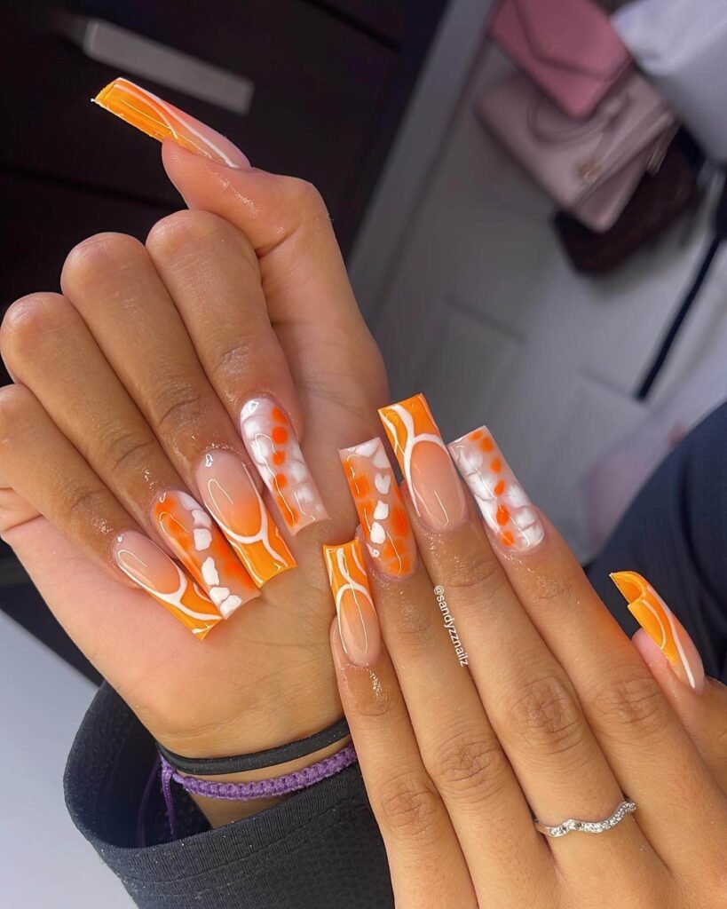 Vibrant orange nail art featuring ombre orange nails, neon orange, and orange french tip nails designs for a chic look.