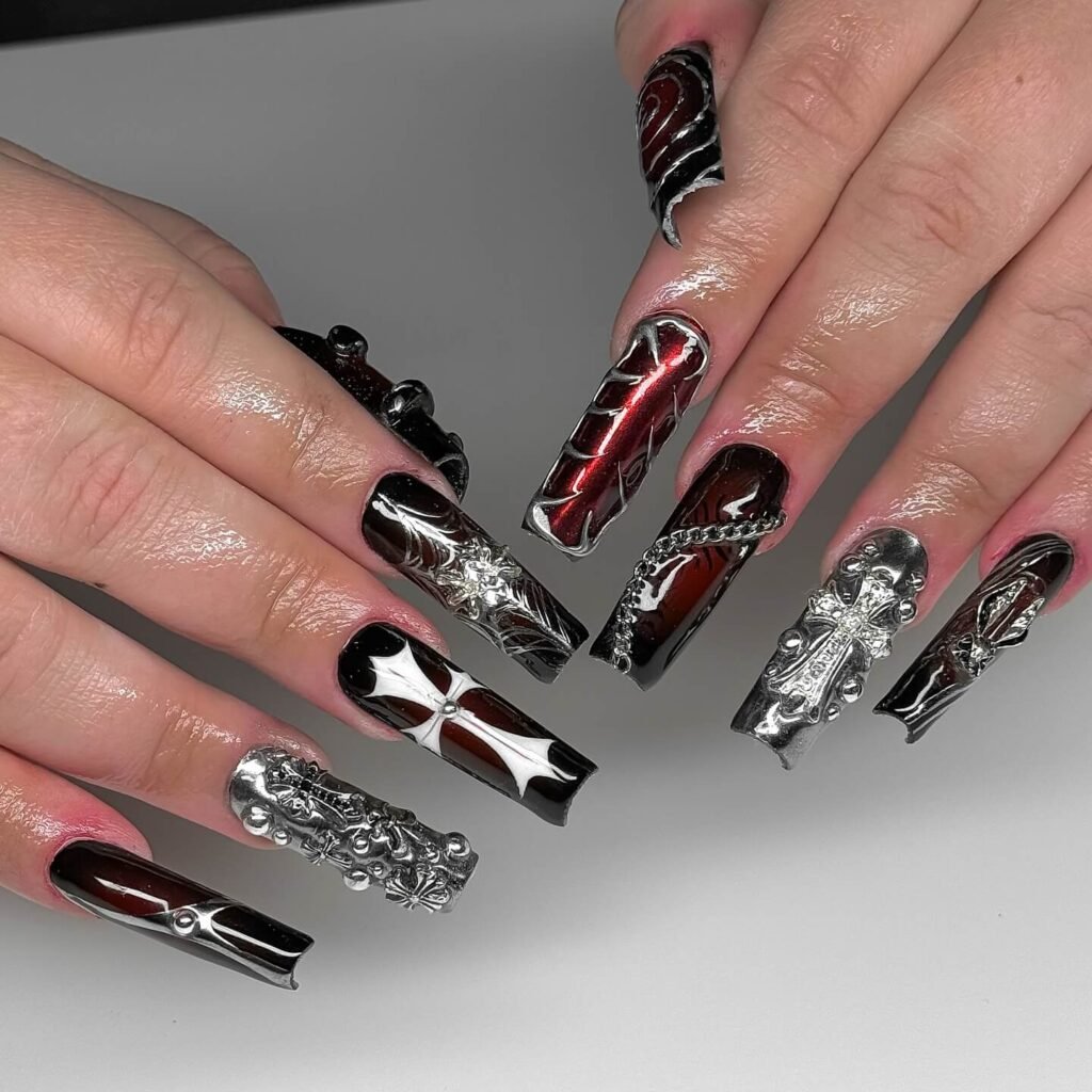 beautifully designed dark nails featuring black and burgundy fall nail designs with a glossy finish.