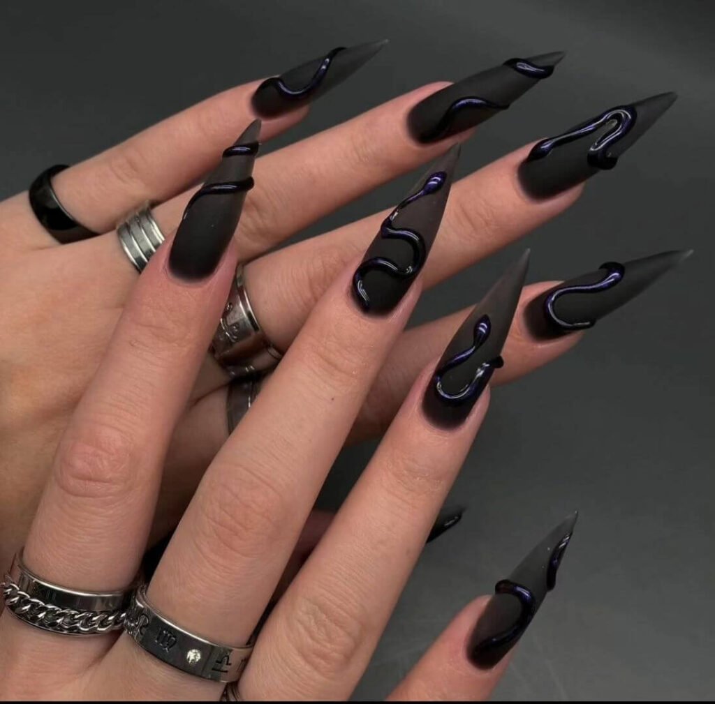 beautifully designed dark nails featuring black and burgundy fall nail designs with a glossy finish.