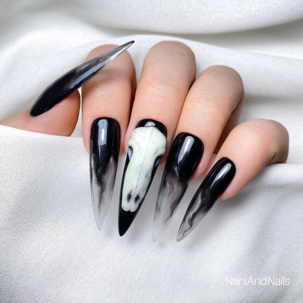 beautifully designed dark nails featuring black and burgundy fall nail designs with a glossy finish.