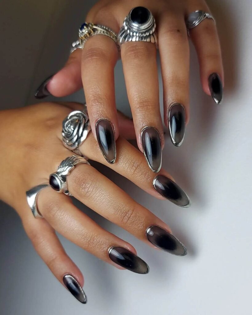 beautifully designed dark nails featuring black and burgundy fall nail designs with a glossy finish.